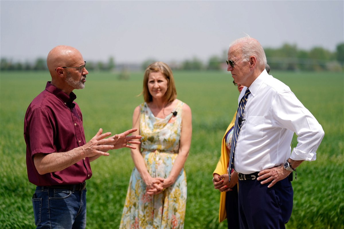 <i>Andrew Harnik/AP</i><br/>President Joe Biden listens as O'Connor Farms owner Jeff O'Connor
