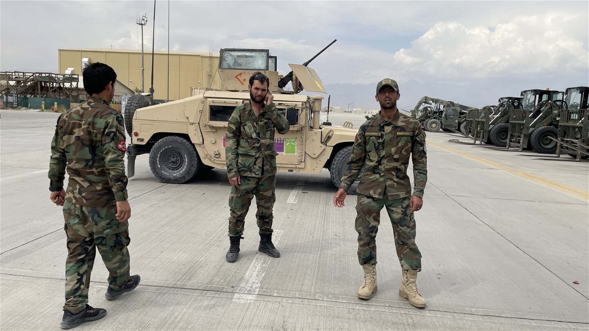 <i>Haroon Sabawoon/Anadolu Agency/Getty Images/FILE</i><br/>A watchdog report says the Trump and Biden administration decisions drove the collapse of Afghan security forces.