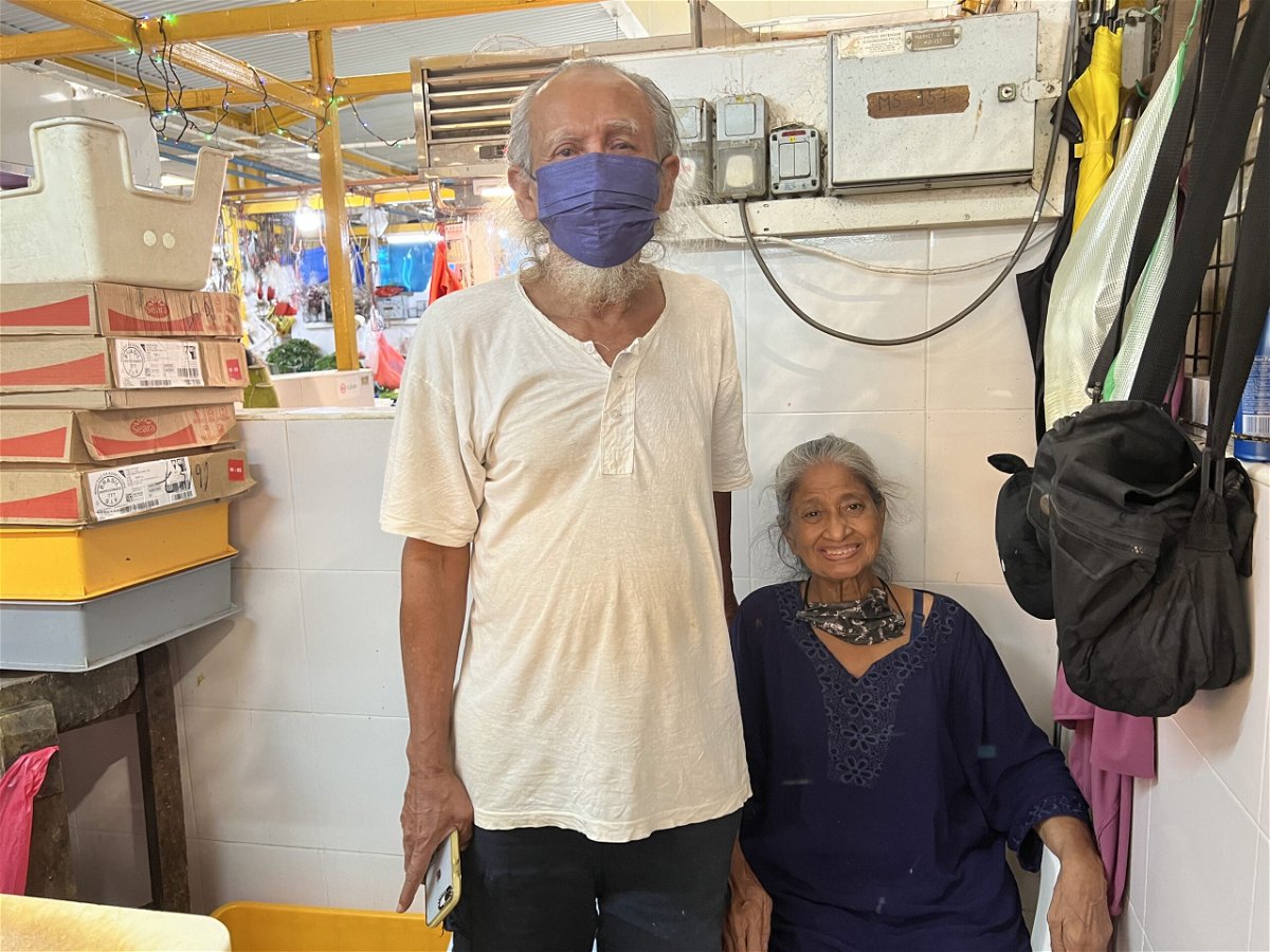 <i>Heather Chen/CNN</i><br/>Chicken seller Mohammad Jalehar and his wife at their market stall in Singapore.