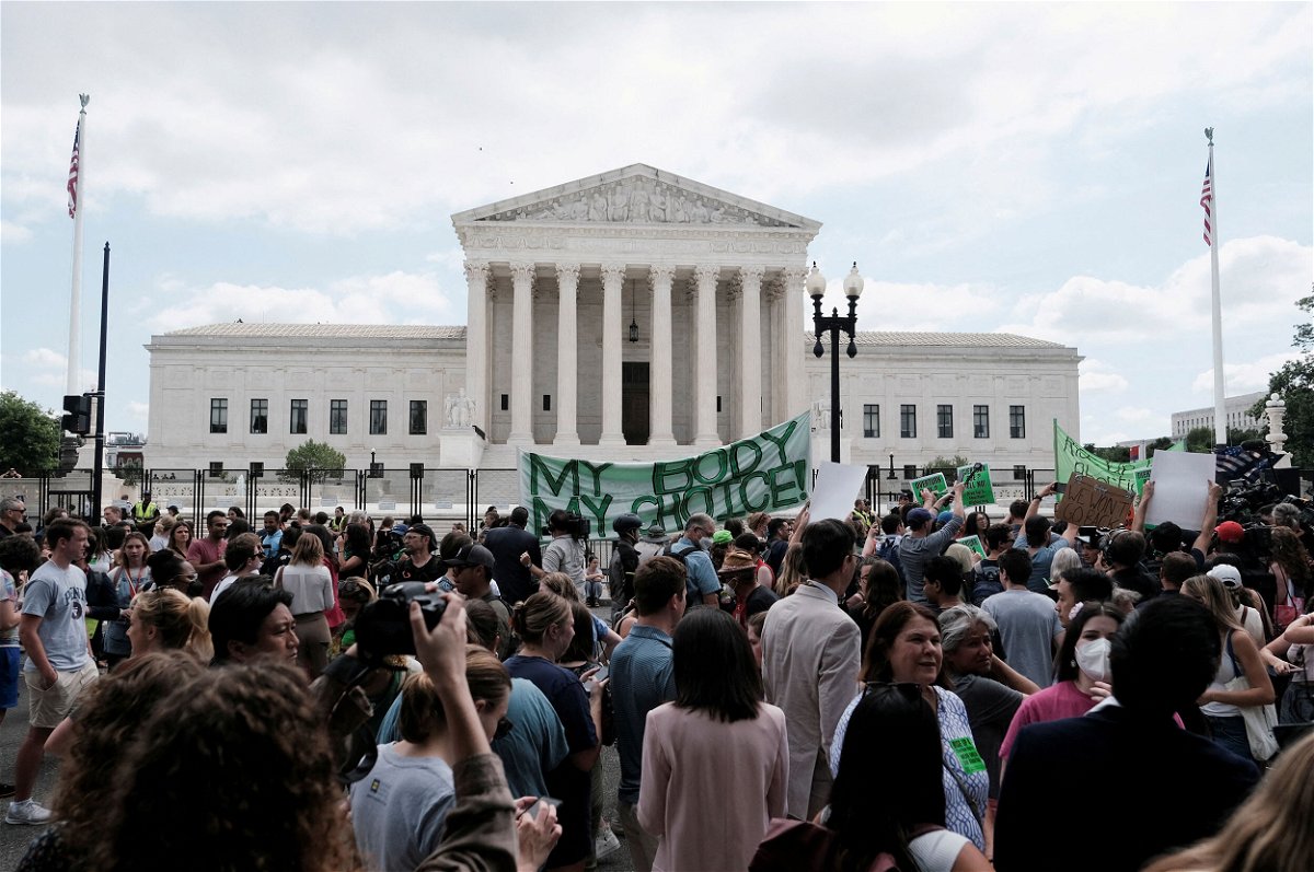 Demonstrators gather outside the United States Supreme Court as the court rules in the Dobbs v Women's Health Organization abortion case