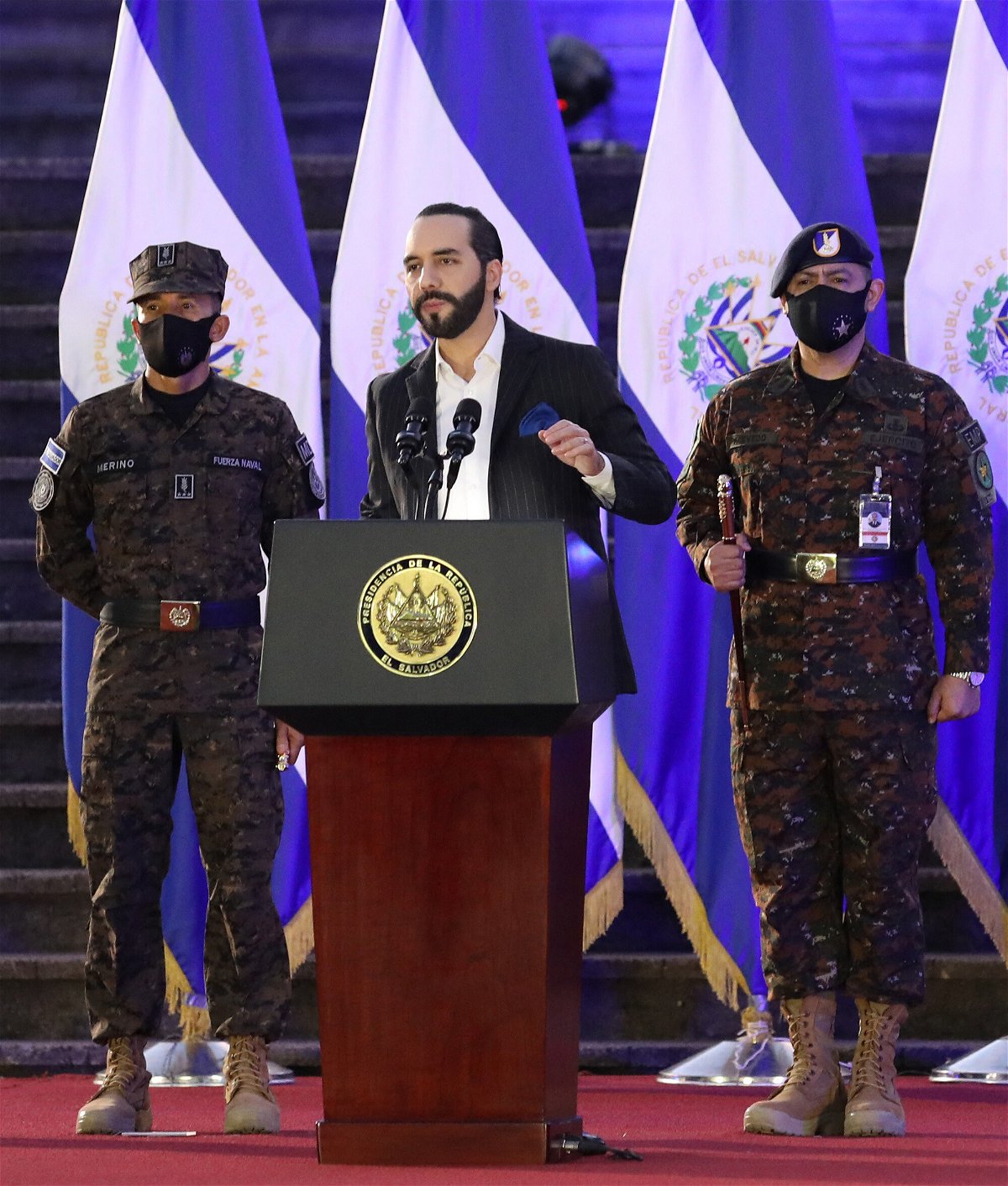 <i>OSCAR RIVERA/AFP/AFP via Getty Images</i><br/>Salvadoran President Nayib Bukele speaks in front of the Salvadoran Armed Forces in San Salvador last July.