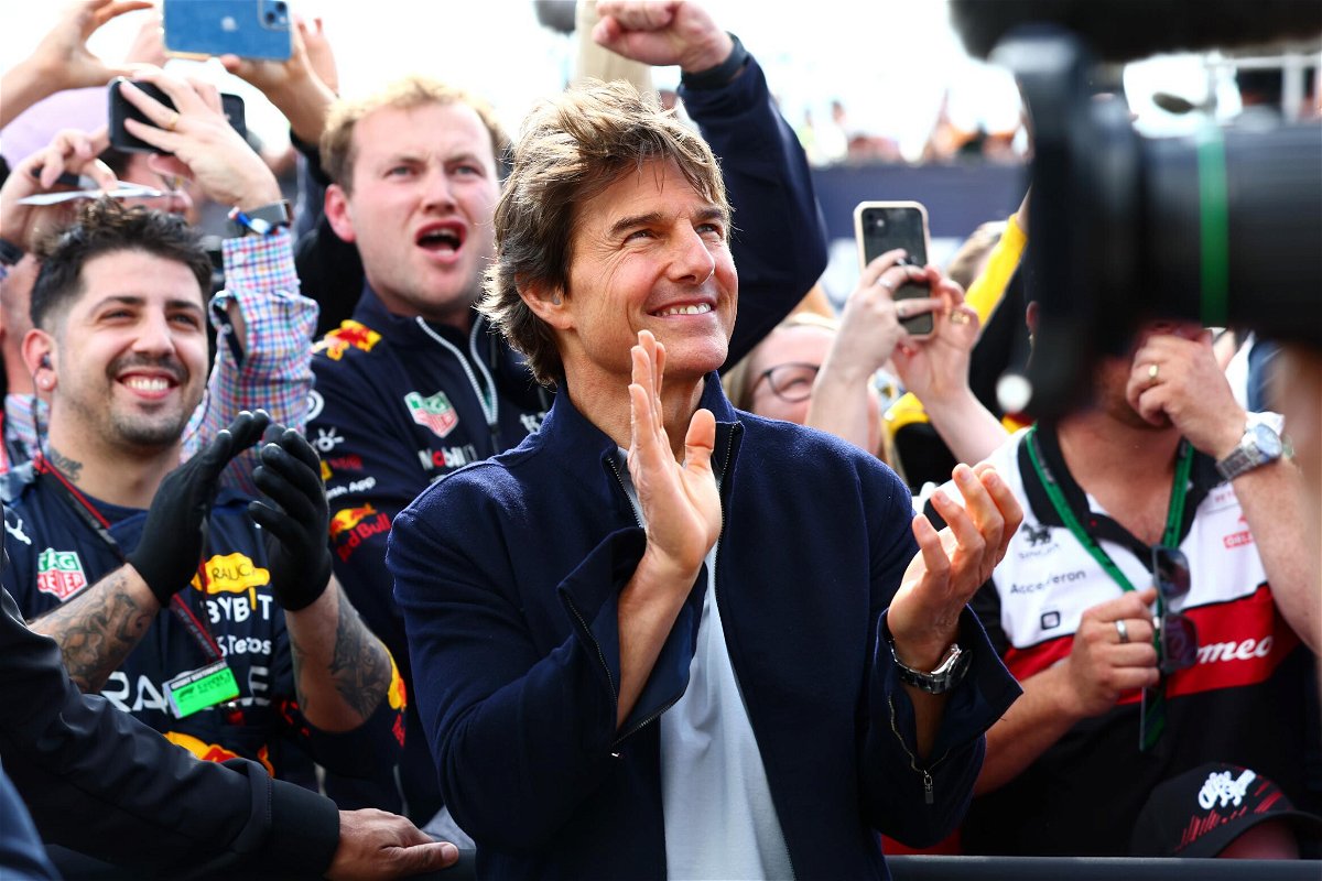 Tom Cruise applauds at the Podium celebrations during the F1 Grand Prix of Great Britain at Silverstone on Sunday in Northampton