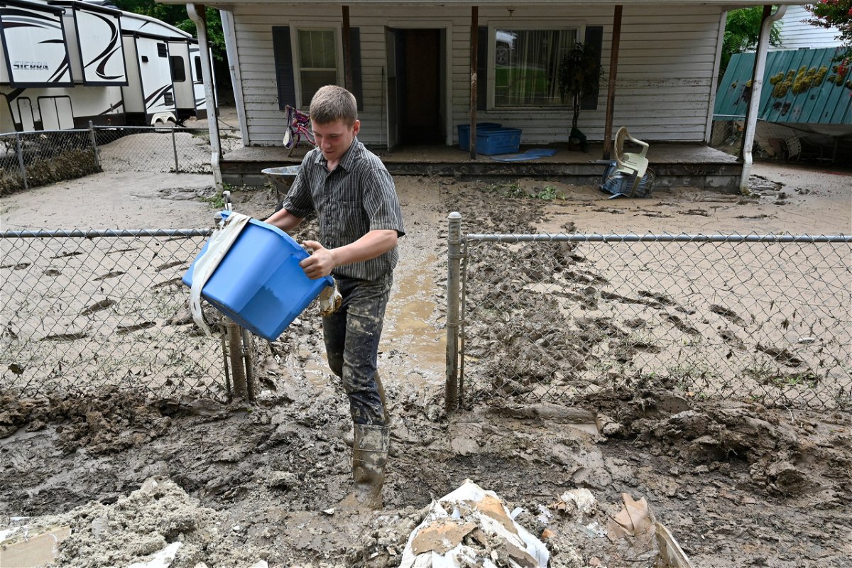 <i>Timothy D. Easley/AP</i><br/>Members of the local Mennonite community remove mud filled debris from homes following flooding at Ogden Hollar in Hindman