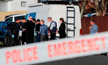 New Zealand police work in Auckland on August 11 after human remains were discovered in suitcases. A woman believed to be the mother of the two children found dead in the suitcases is in South Korea.