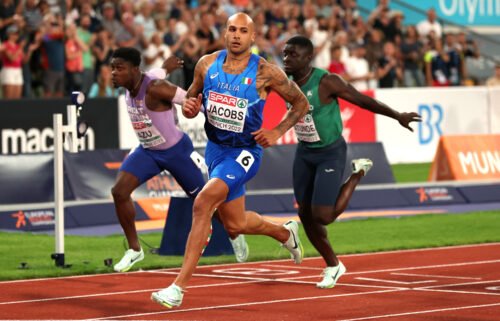 Jacobs crosses the finish line during the men's 100m final at the 2022 European Championships on August 16.