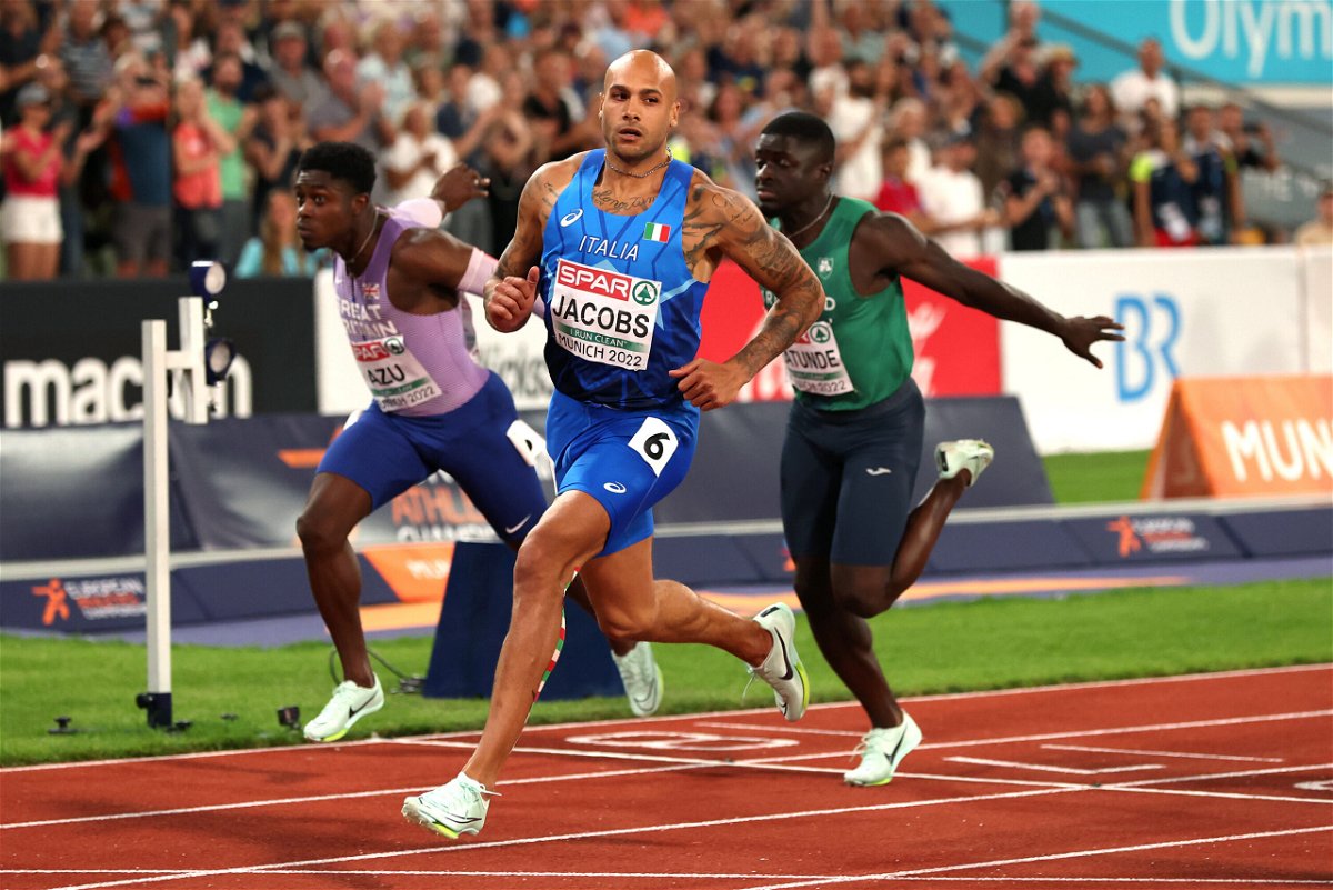 <i>Alexander Hassenstein/Getty Images</i><br/>Jacobs crosses the finish line during the men's 100m final at the 2022 European Championships on August 16.
