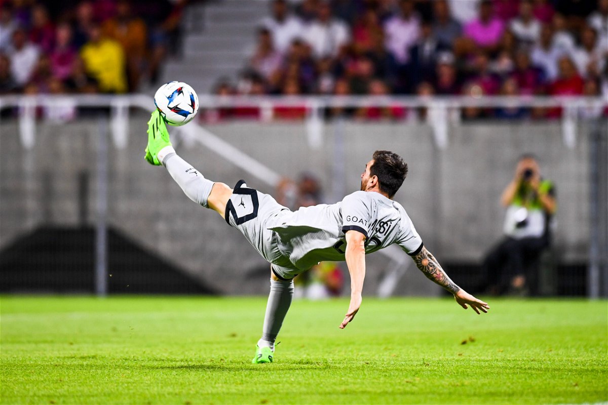 <i>Philippe Lecoeur/FEP/Icon Sport/Getty Images</i><br/>Lionel Messi scores his second goal of the game with an acrobatic effort. PSG won 5-0.