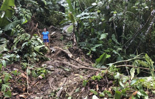 Nancy Galarza looks at the damage Hurricane Fiona inflicted on her rural community of San Salvador in the town of Caguas