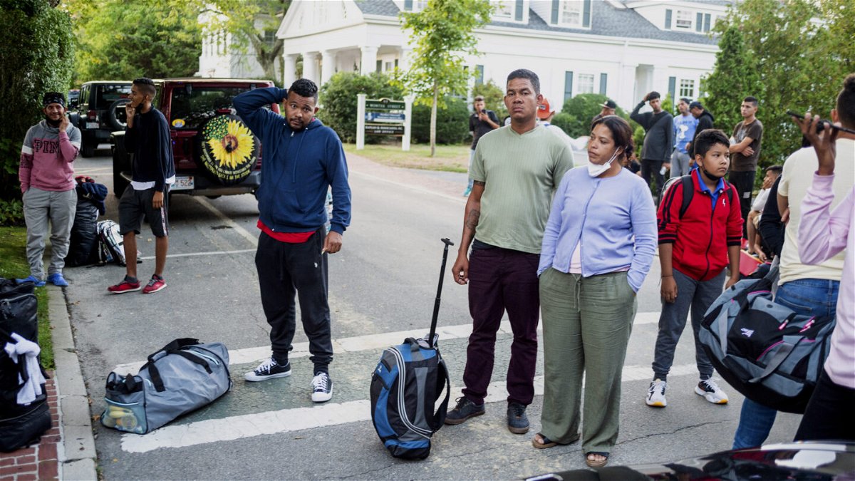 <i>Ray Ewing/Vineyard Gazette/AP</i><br/>Biden administration officials are set to meet on September 16 to discuss a multitude of critical immigration issues. Immigrants are pictured here gathering with their belongings outside St. Andrews Episcopal Church