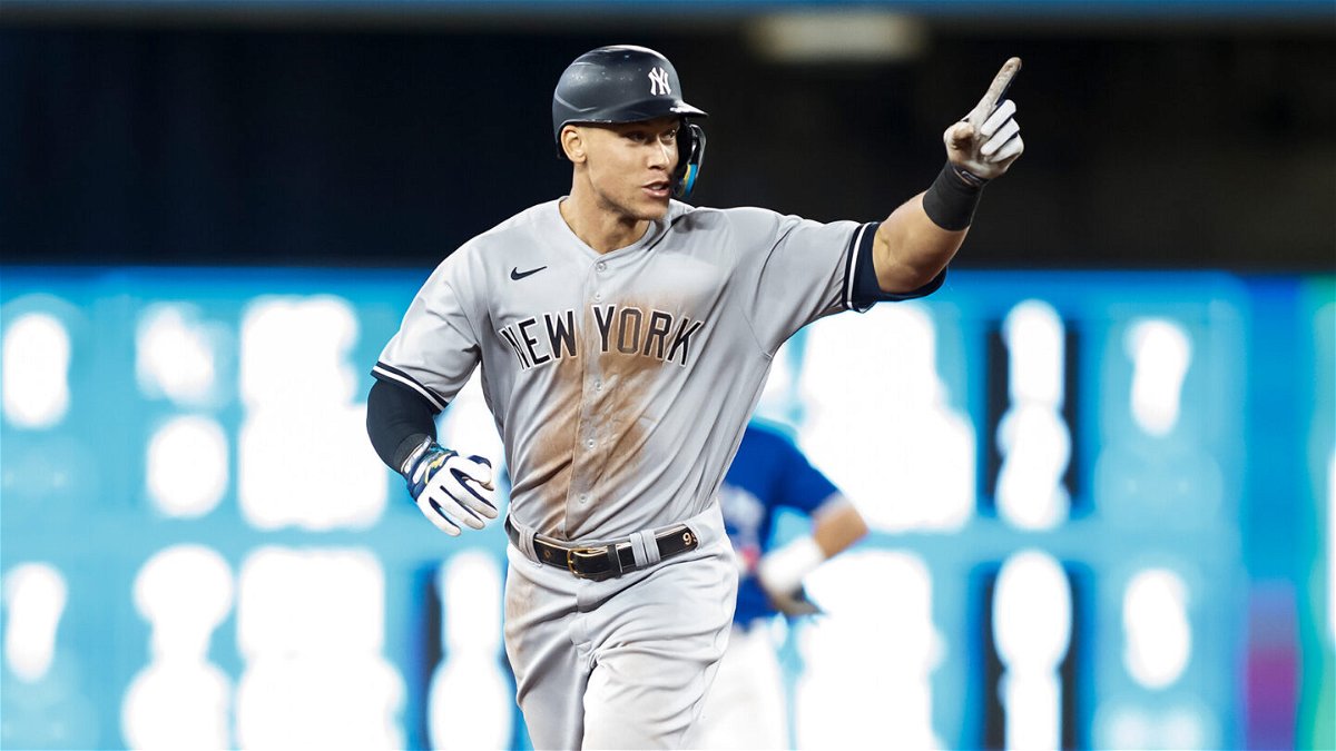 <i>Cole Burston/Getty Images</i><br/>Aaron Judge runs the bases as he hits his 61st home run of the season in the 7th inning against the Toronto Blue Jays at Rogers Centre on September 28.