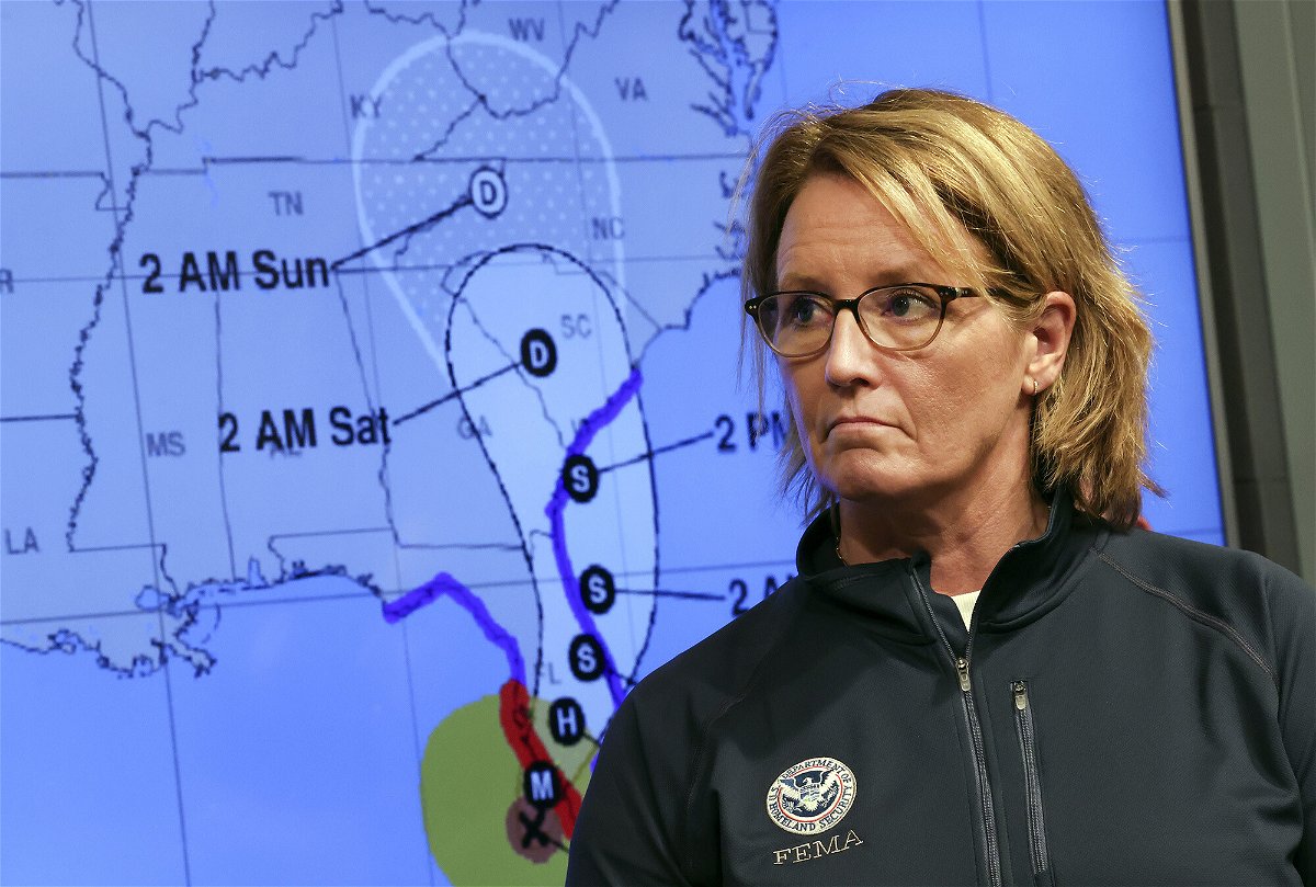 <i>Kevin Dietsch/Getty Images</i><br/>Federal Emergency Management Agency administrator Deanne Criswell stands next to a track map of Hurricane Ian during a news conference at FEMA headquarters on September 28