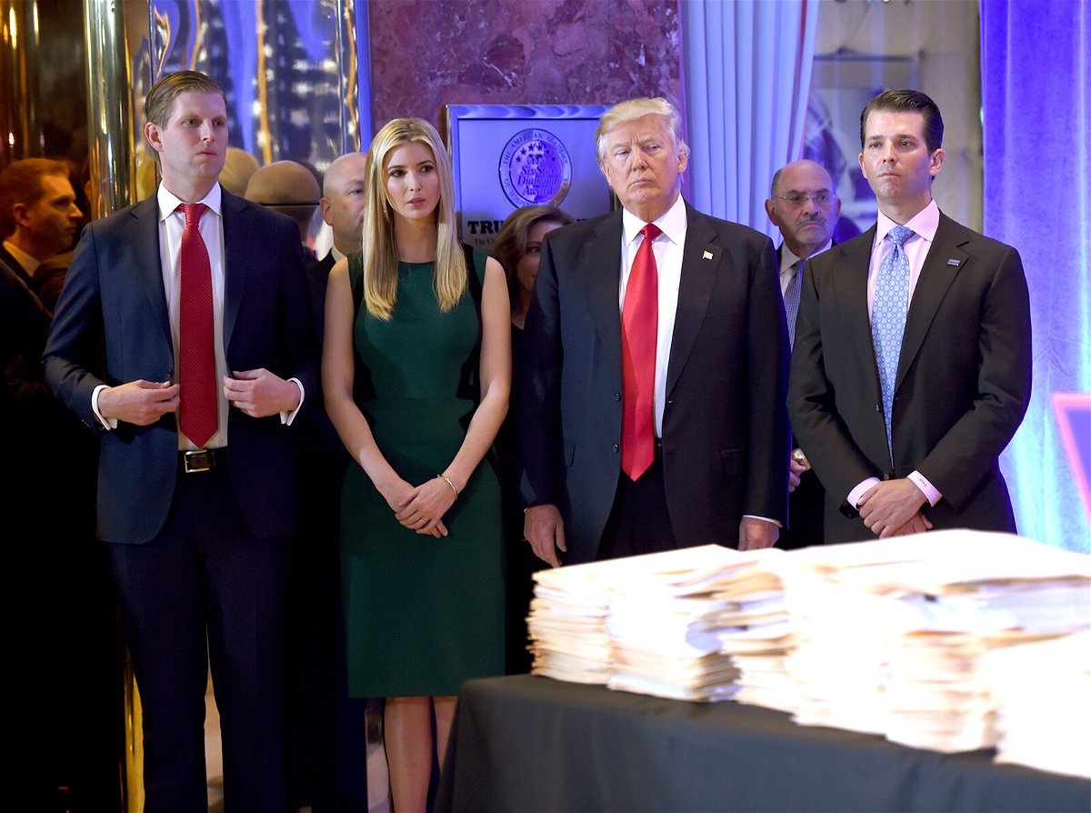 <i>TIMOTHY A. CLARY/AFP/Getty Images</i><br/>Then-President-elect Donald Trump along with his children Eric