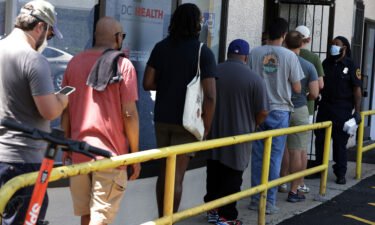 Residents wait in line at a DC Health location administering the monkeypox vaccine on August 5