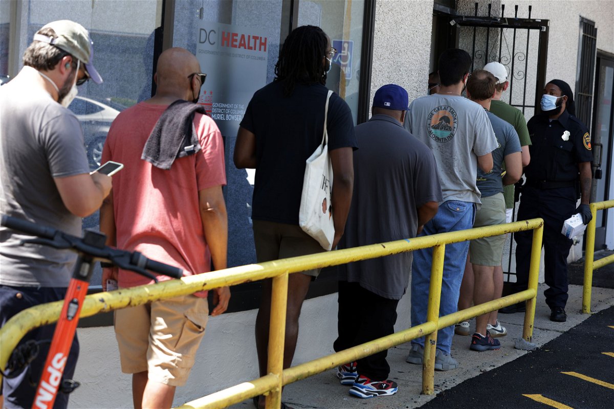 <i>Alex Wong/Getty Images</i><br/>Residents wait in line at a DC Health location administering the monkeypox vaccine on August 5