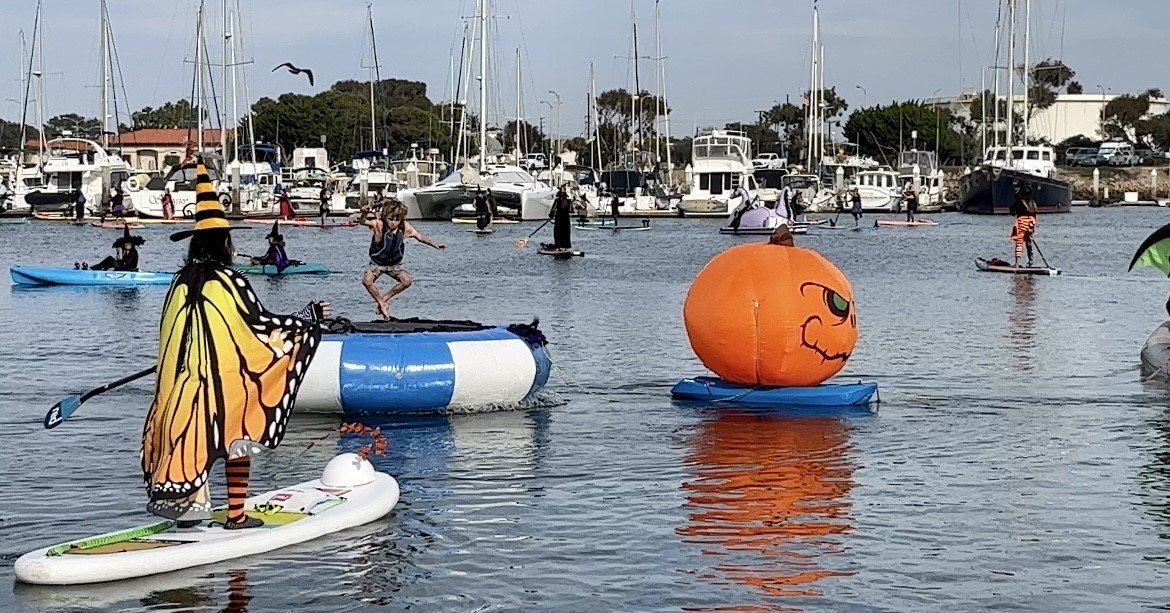 Witches trade brooms for paddles in Ventura Harbor