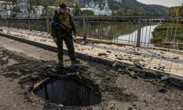 A member of Ukraine's National Guard stands at a bridge over the Siverskyi Donets river in the Donetsk region on October 1.