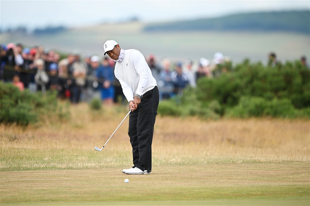 <i>Stuart Franklin/R&A/Getty Images</i><br/>Woods plays a shot at the Open Championship in St. Andrews