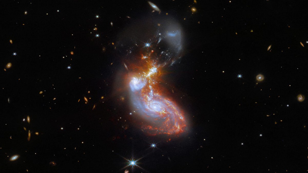 <i>NASA/ESA</i><br/>A merging galaxy pair cavort in this image captured by the James Webb Space Telescope. This pair of galaxies