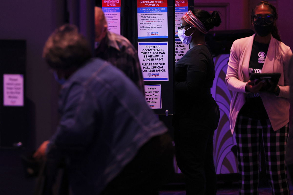 <i>Michael M. Santiago/Getty Images</i><br/>People cast their ballot during the Midterm Elections at Fox Theatre on November 8 in Atlanta