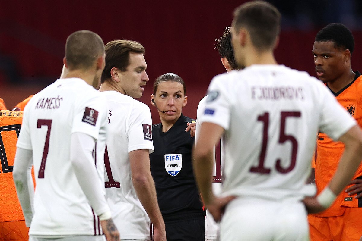 <i>Dean Mouhtaropoulos/Getty Images</i><br/>Stéphanie Frappart talks to the players during the FIFA World Cup 2022 Qatar qualifying match between the Netherlands and Latvia in March 2021.