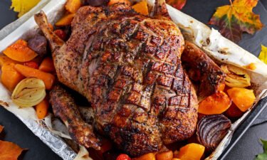 Need a replacement bird at Thanksgiving? Duck roast with baked vegetables is one alternative to turkey.
