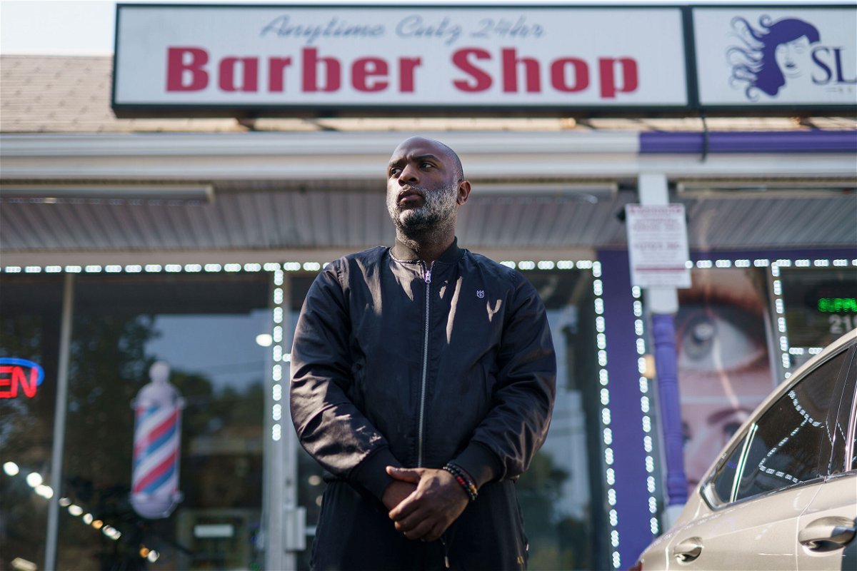<i>Elijah Nouvelage for CNN</i><br/>Aaron Bethea poses for a portrait outside Anytime Cutz barbershop in Atlanta.