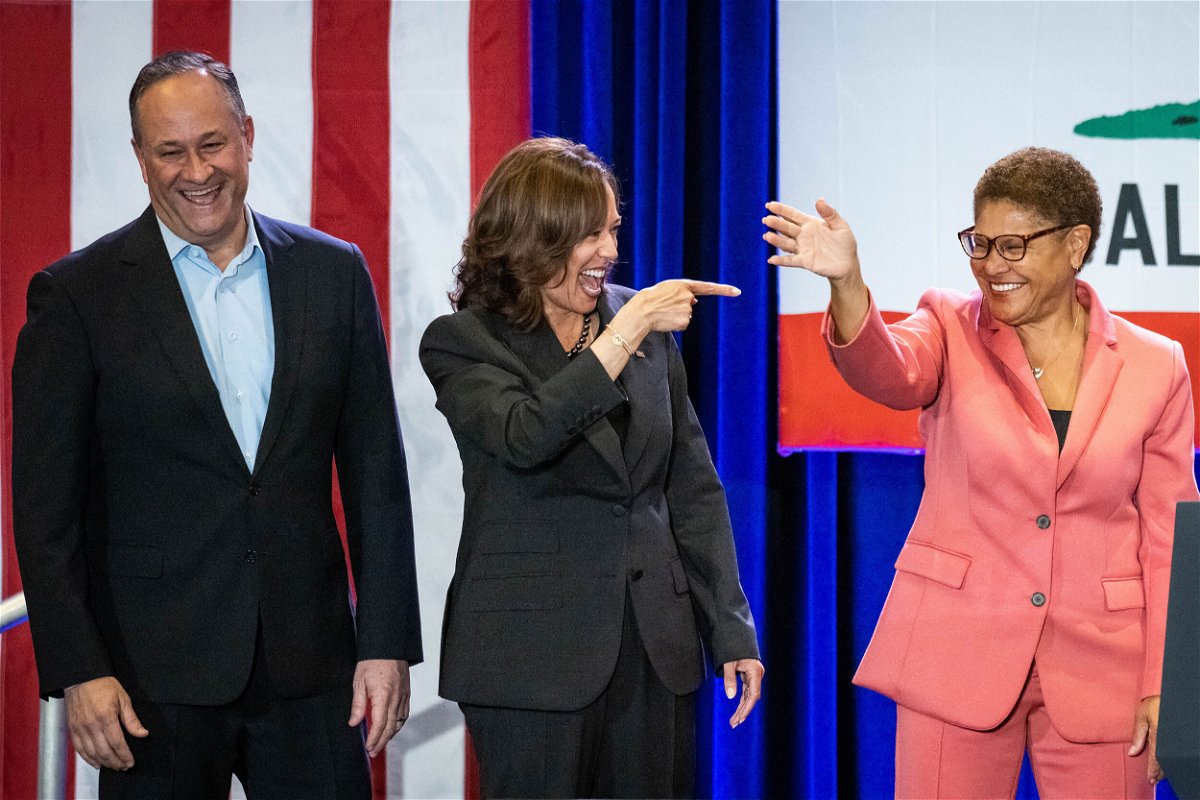 <i>Sarah Reingewirtz/MediaNews Group/Los Angeles Daily News/Getty Images</i><br/>Vice President Kamala Harris (middle) and second gentleman Doug Emhoff (left) join Karen Bass as she campaigns at UCLA in Los Angeles on November 7.