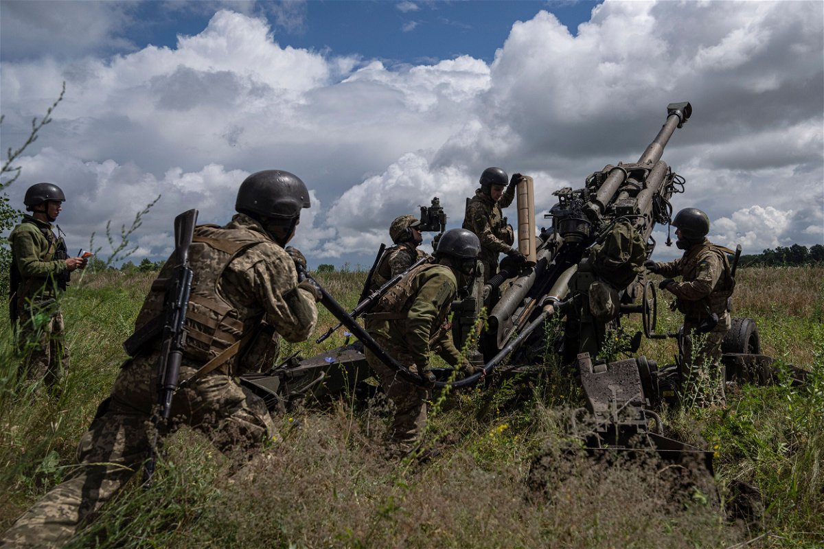 <i>Evgeniy Maloletka/AP</i><br/>Ukrainian servicemen prepare to fire at Russian positions from a U.S.-supplied M777 howitzer in Kharkiv region