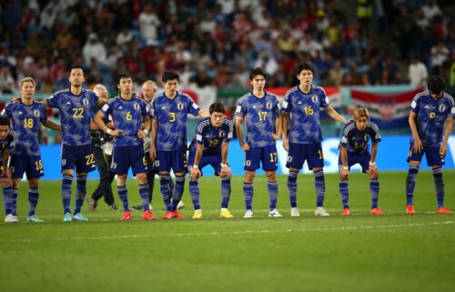 Japan's players look dejected at the end of the last-16 match against Croatia