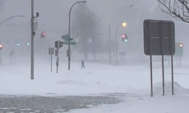 High winds and snow covers the streets and vehicles in Buffalo