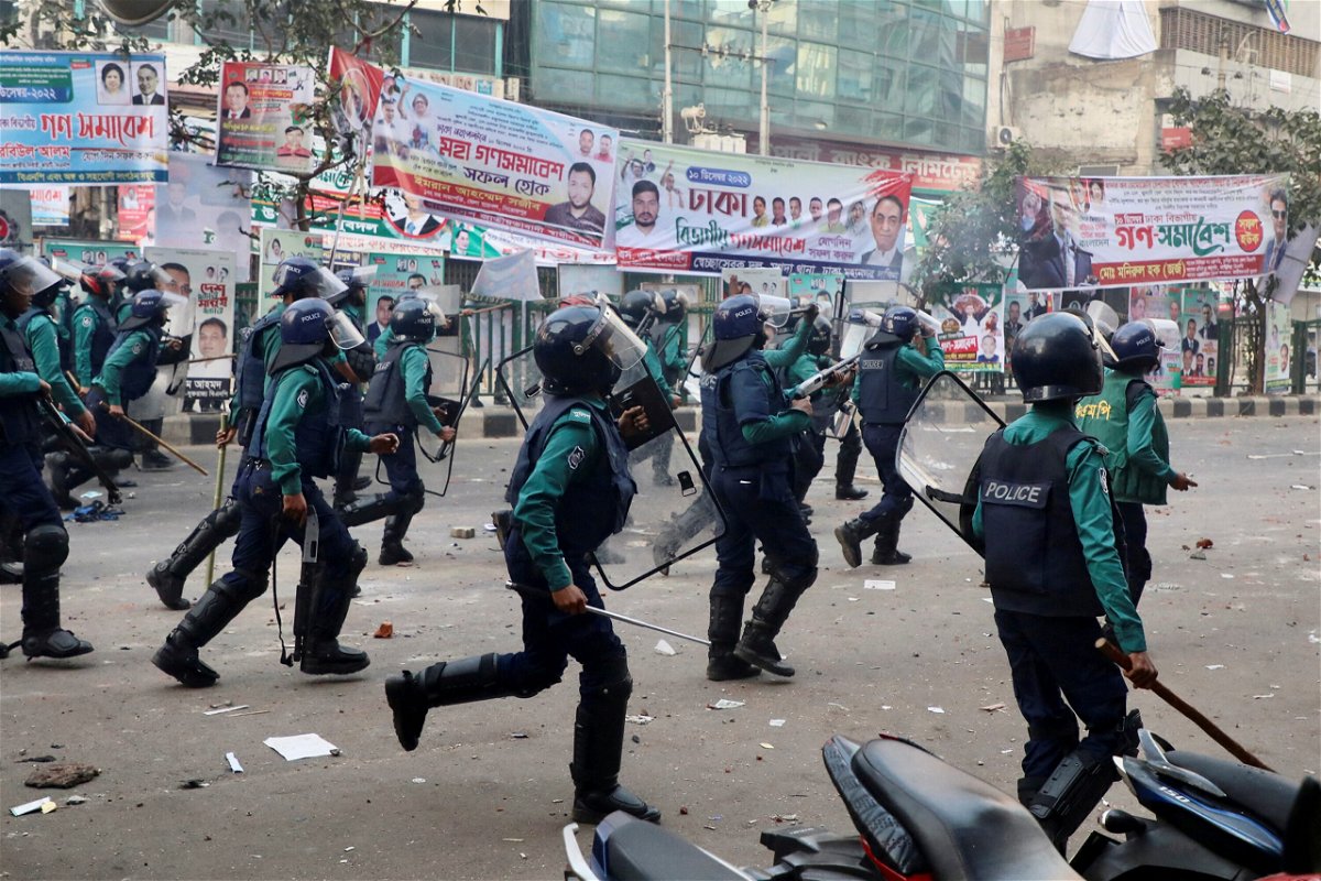 <i>Stringer/Reuters</i><br/>Bangladeshi policemen disperse Bangladesh Nationalist Party (BNP) activists on December 7.
