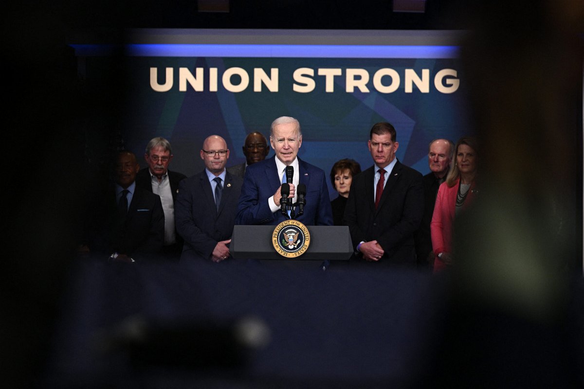 <i>Brendan Smialowski/AFP/Getty Images</i><br/>President Joe Biden speaks about strengthening the economy for union workers and retirees on December 8 in Washington