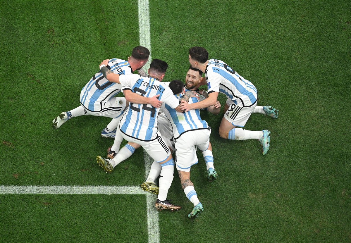 <i>Matthias Hangst/Getty Images</i><br/>Lionel Messi celebrates with teammates after scoring Argentina's first goal of the World Cup final.