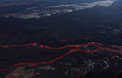 Lava flows from a fissure of Mauna Loa Volcano as it erupts in Hilo