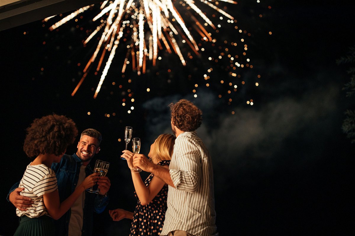 <i>Dimensions/E+/Getty Images</i><br/>An outdoor celebration is lower risk than an indoor event when it comes to the spread of respiratory viral infections
