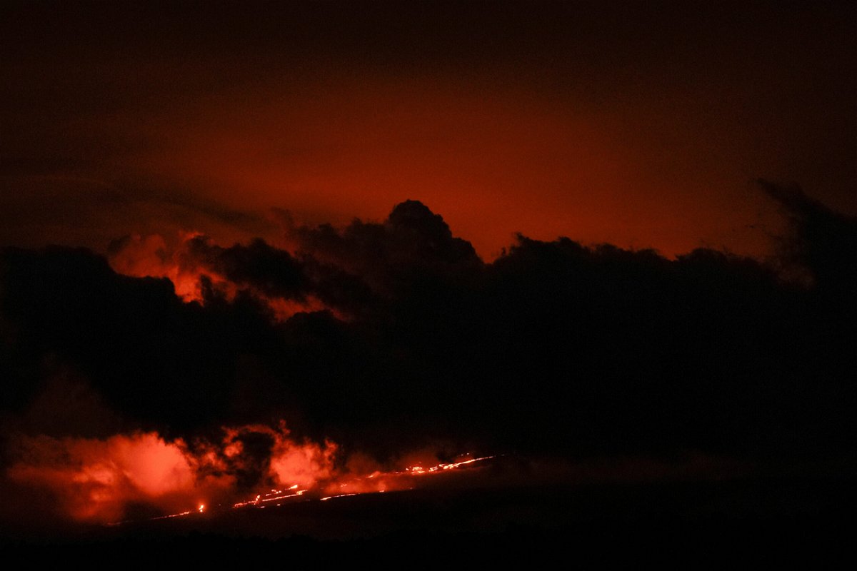 <i>Gregory Bull/AP</i><br/>Lava flows from the Mauna Loa volcano Friday