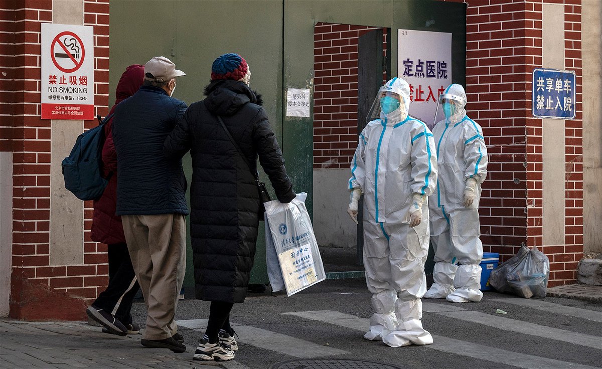 <i>Kevin Frayer/Getty Images</i><br/>Medical staff at a fever clinic treating Covid-19 patients in Beijing