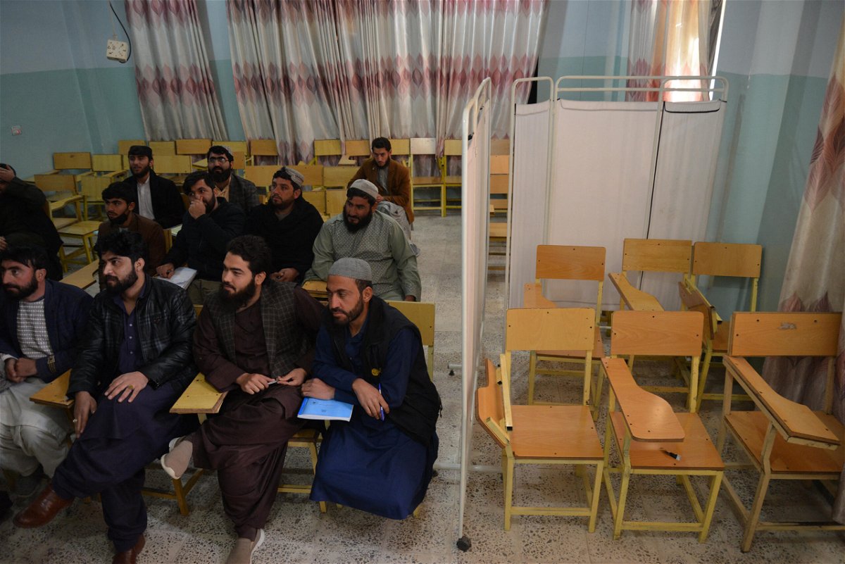 <i>Stringer/AFP/Getty Images</i><br/>Male students attend a class behind a curtain meant to separate men from women at a university in Kandahar province
