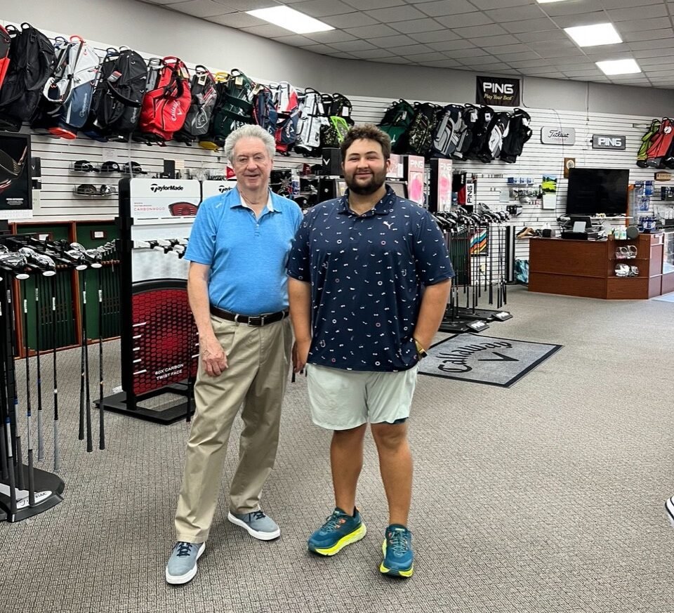 Golf Max Owner Alex Bollag stands with Previous Owner 