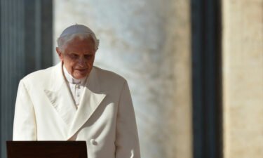 Pope Benedict XVI walks to the altar as he arrives on St Peter's square for his last weekly audience on February 27