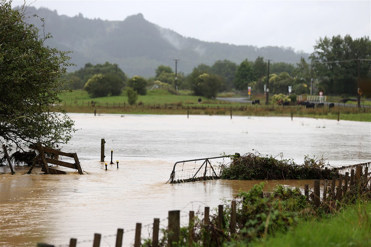 <i>Fiona Goodall/Getty Images</i><br/>Flooding blocks roads in Auckland's Kaipara Flats community on January 30.