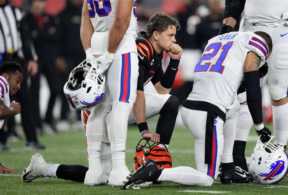 <i>Dylan Buell/Getty Images</i><br/>Joe Burrow reacts after Hamlin collapsed on Monday.