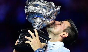 Novak Djokovic celebrates with the Australian Open in Melbourne on January 29.