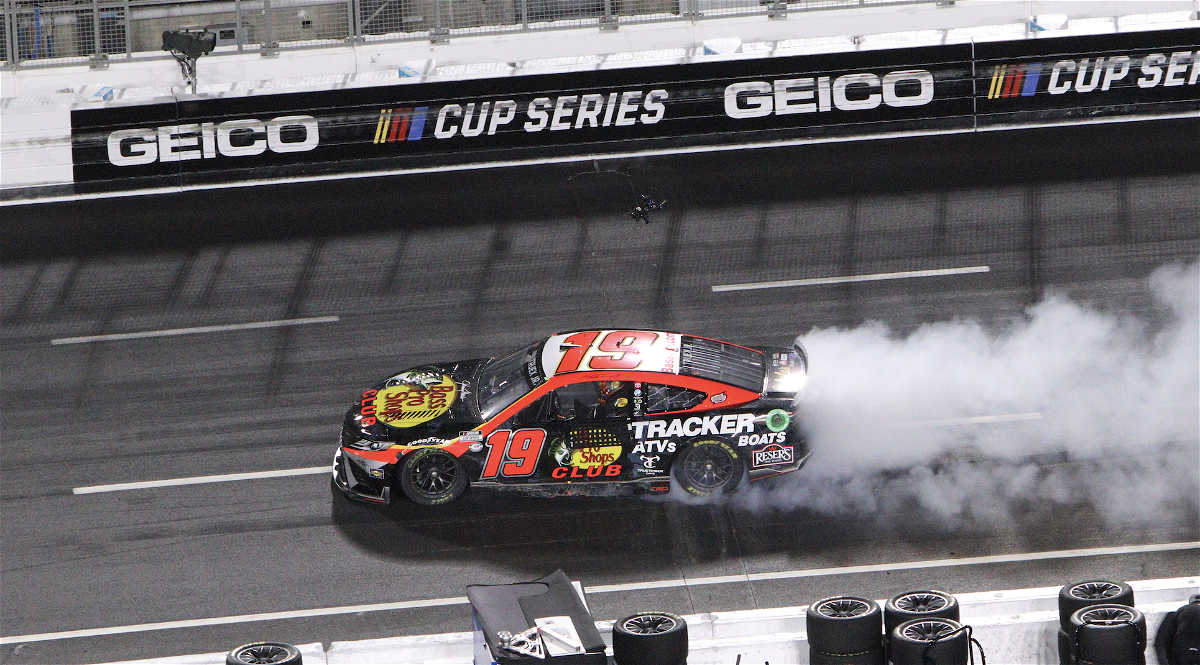 Martin Truex Jr. rips off a victory burn out at the L.A. Coliseum after winning the Busch Light Clash.