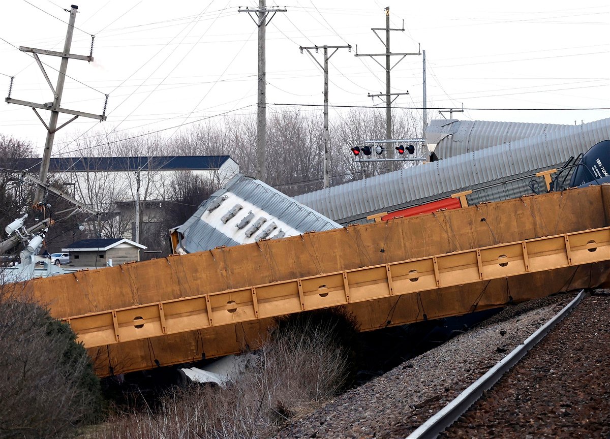<i>Bill Lackey/Springfield-News Sun/AP</i><br/>Multiple cars of a Norfolk Southern train lie toppled on one another after derailing at a train crossing with Ohio 41 in Clark County