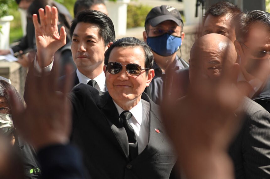 Former president Ma Ying-Jeou (center) waves to the crowd during a ceremony in Taipei