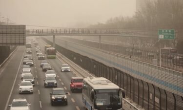 Cars drive in low-visibility through a sandstorm on March 22
