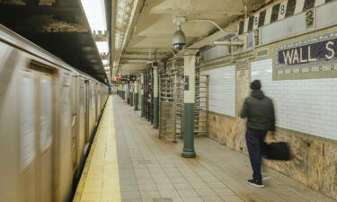 A commuter at the Wall Street subway station in New York