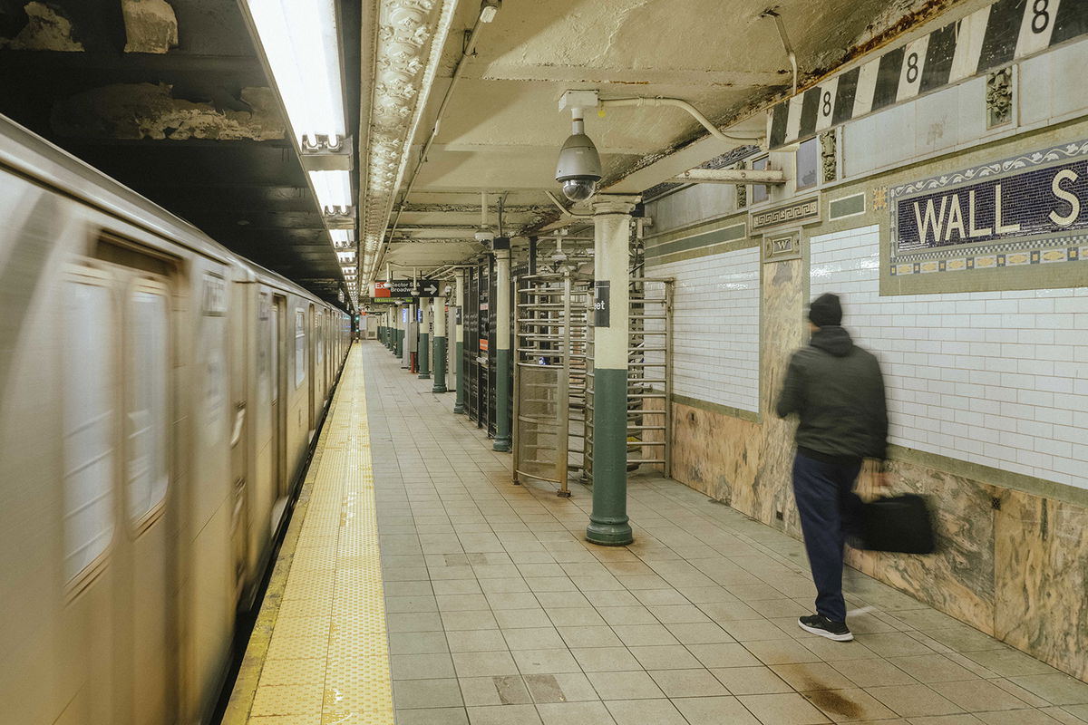 <i>Ismail Ferdous/Bloomberg/Getty Images</i><br/>A commuter at the Wall Street subway station in New York