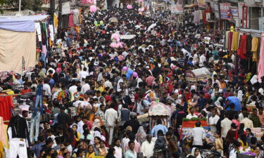 A crowd of shoppers gathers at a market on March 2